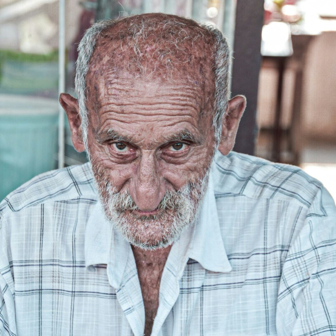 Elderly Croatian man portrait in traditional village setting