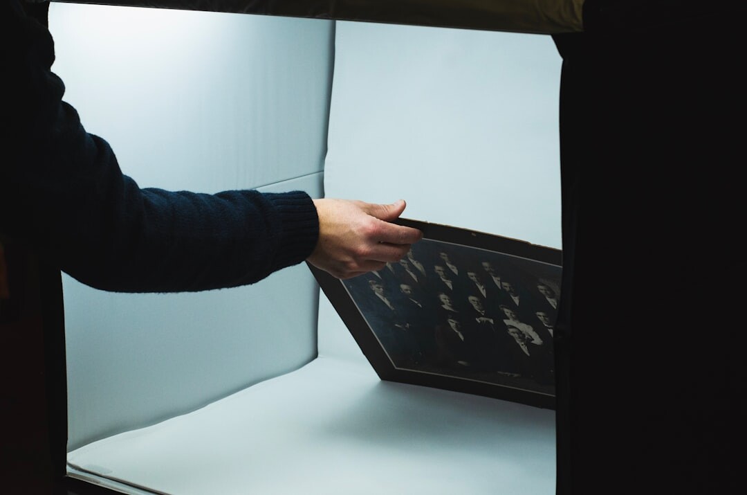 Photographer reviewing photo prints on a light table